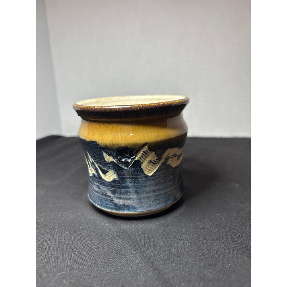 Pottery in Browns‎ and Blue